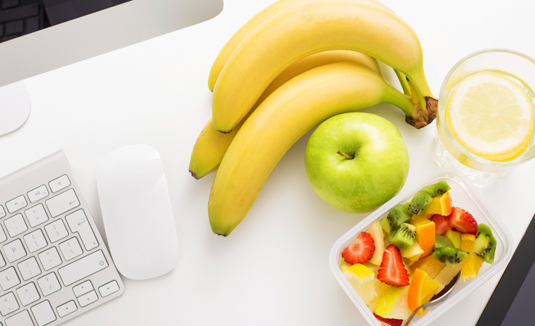 Healthy fruits next at a workspace